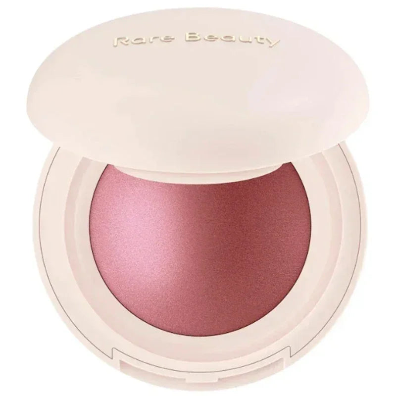 Rubor compacto en tono rosa perlado con envase redondo beige, maquillaje facial