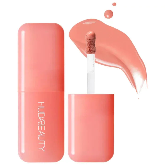 Gloss labial líquido color durazno con aplicador, empaque rosa, maquillaje belleza