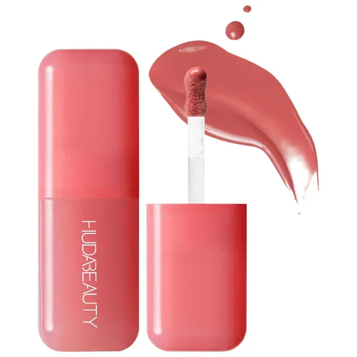 Brillo labial líquido rosa con aplicador y envase moderno, maquillaje de labios